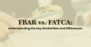 A person holds a magnifying glass over documents with the text “FBAR vs. FATCA: Understanding the Key Similarities and Differences” in bold letters.